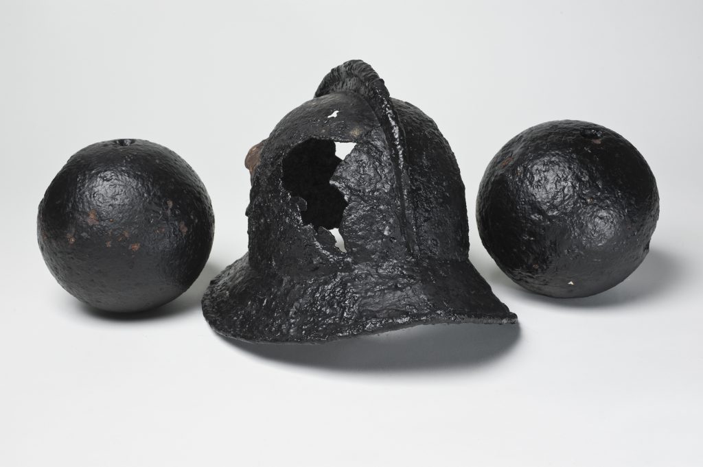 Cannonballs and helmet found during the excavation of David's Tower, Edinburgh Castle